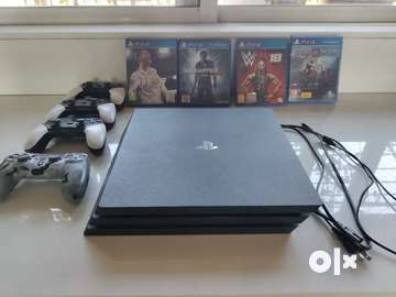 PS4 pro with four controller Games Entertainment 1760564103