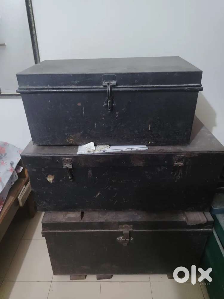 Vintage dark painted metal storage trunks
