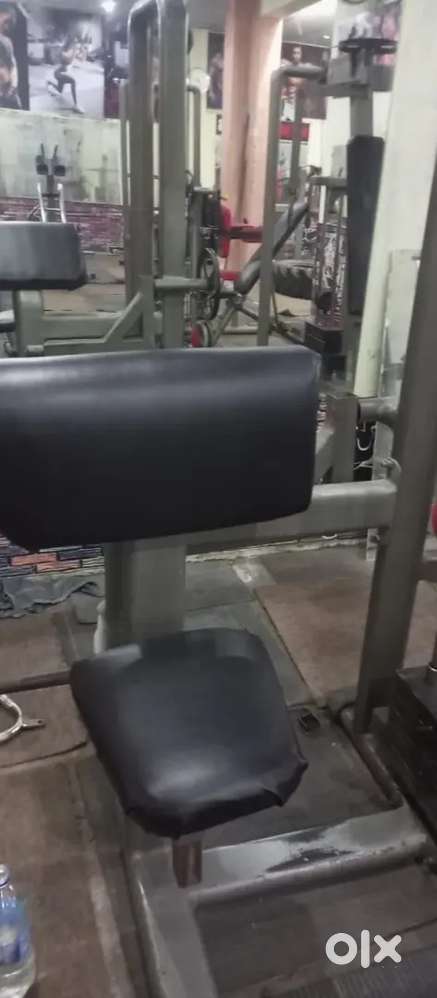 Preacher curl machine and shoulder side lateral with weight also