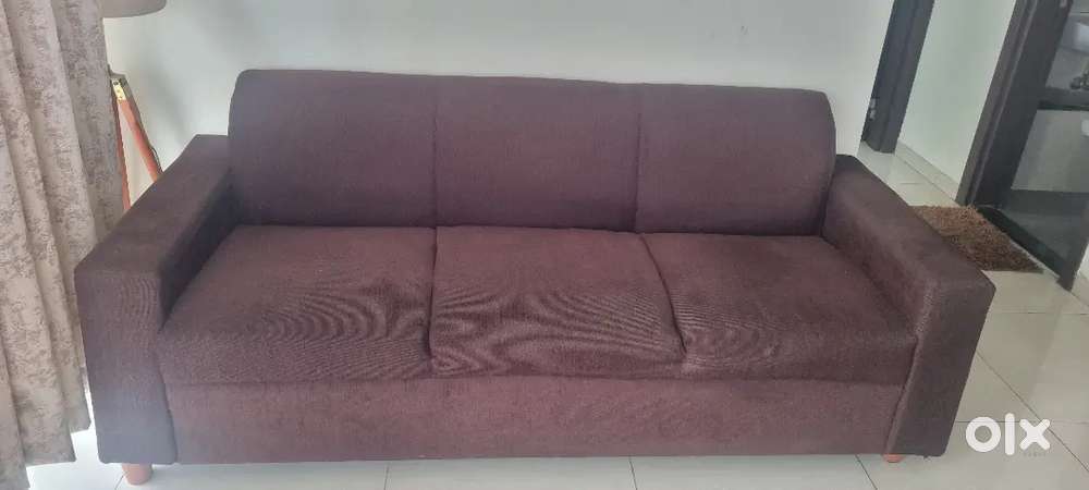 3 seater brown sofa with back rest