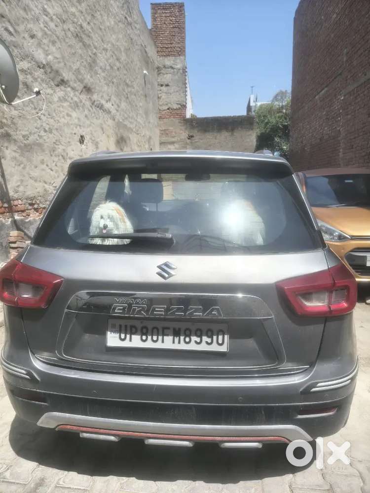 Maruti Brezza Zxi + Primium Silver Colour Excellent Condition.