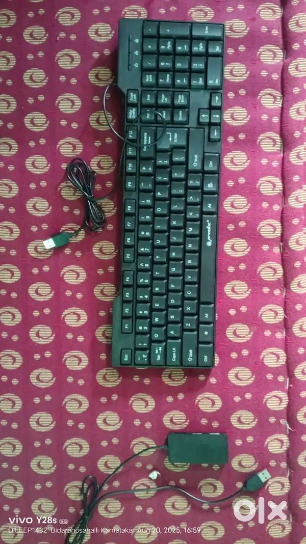 His mobile and tab coneteda keyboard and computer