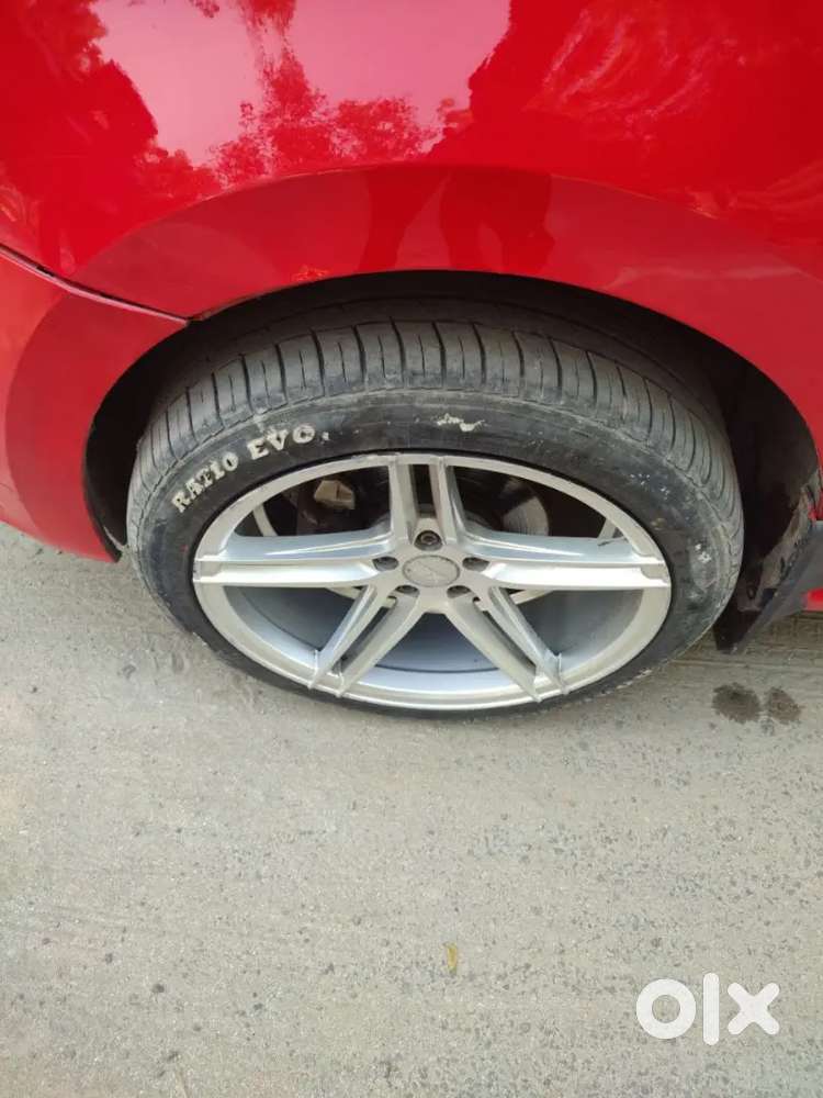It's A Red Colour Polo With 17 Inchi Alloys