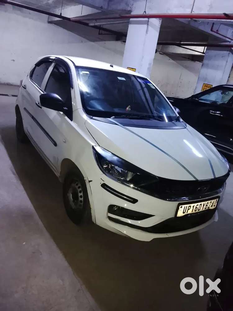 2023 October Tata Tata Tiago Xe (petrol) - White  21,000 Km