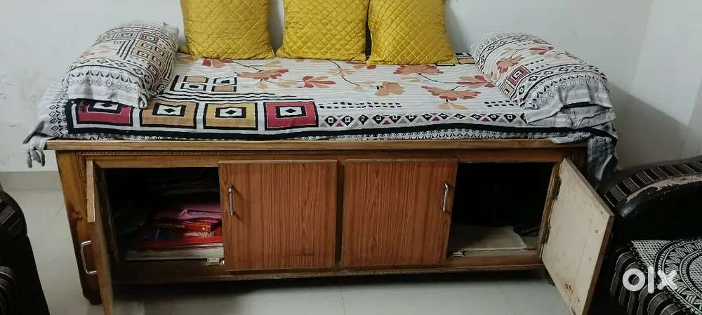 A diwan with mattress and pillows