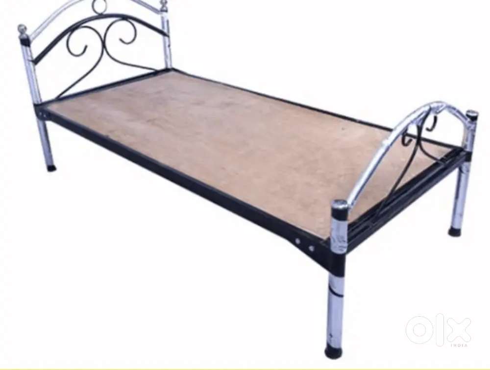 Steel bed with mattress and cupboard