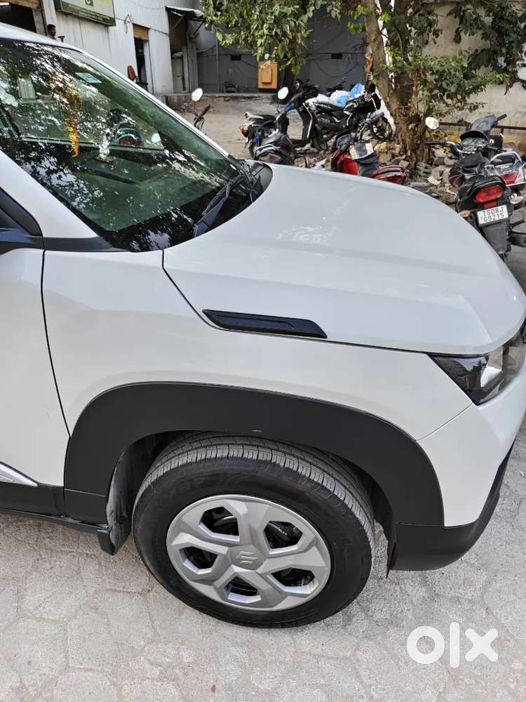2025 Maruti Suzuki Brezza Lxi Petrol  5,000 Km  1st Owner