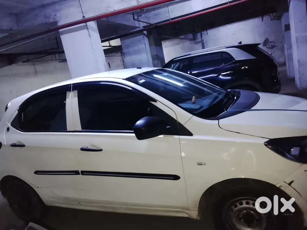 2023 October Tata Tata Tiago Xe (petrol) - White  21,000 Km