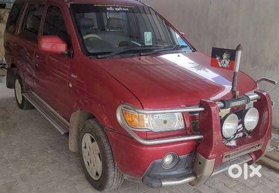 Well Maintained 2012 Red Tavera 10 Seater For Sale