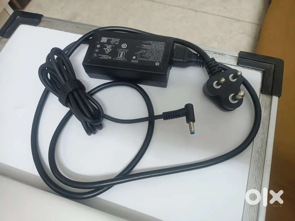 Original HP 65W charger for sell.
