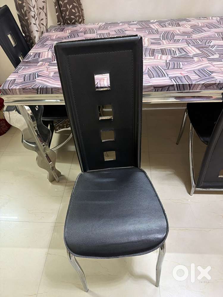 Marble top stain less steel dining table