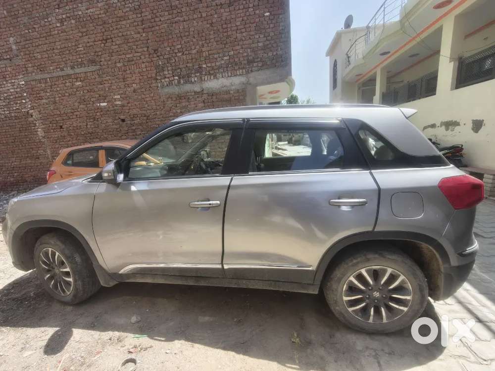 Maruti Brezza Zxi + Primium Silver Colour Excellent Condition.
