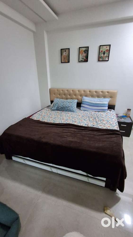 Double bed , wardrobe , wooden shelf