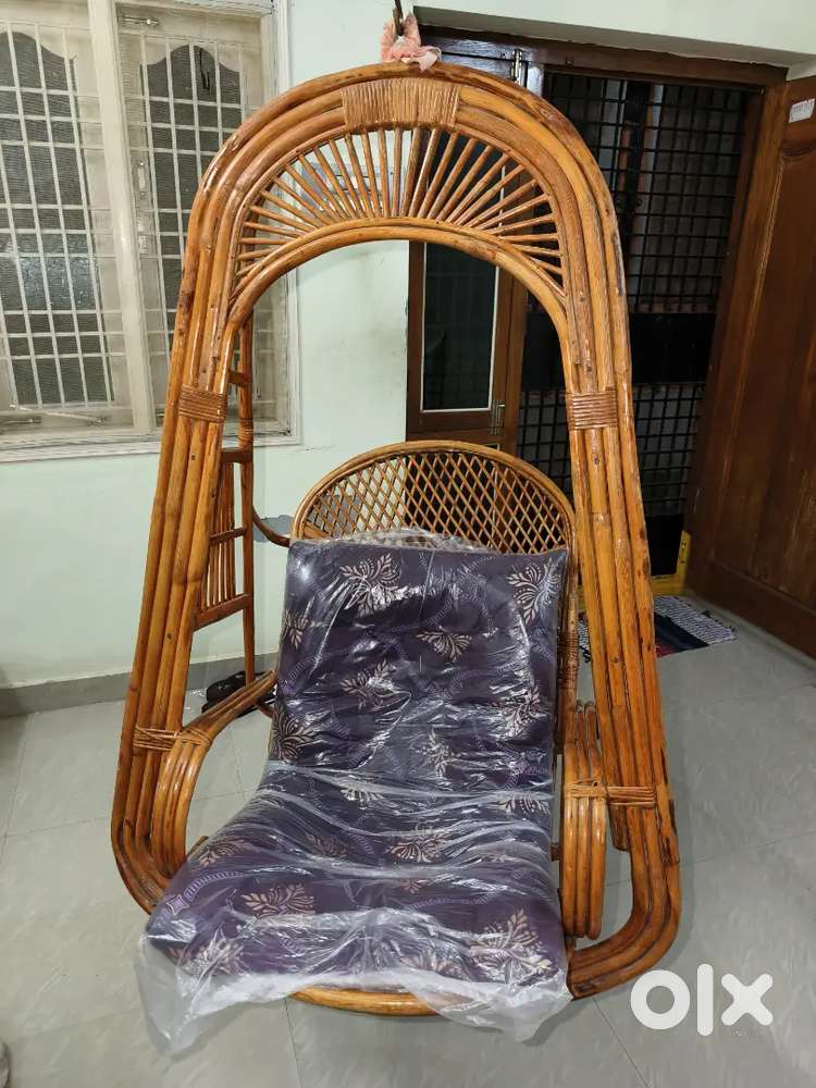 Bamboo cane swing chair with cushion in excellent condition