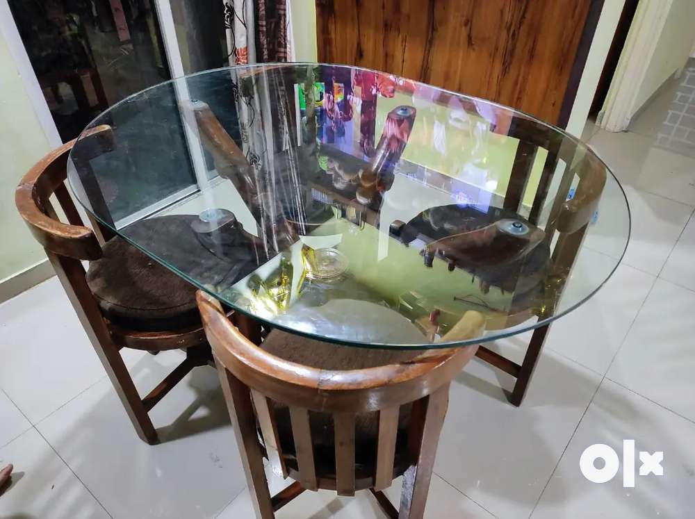 Olx glass dining deals table