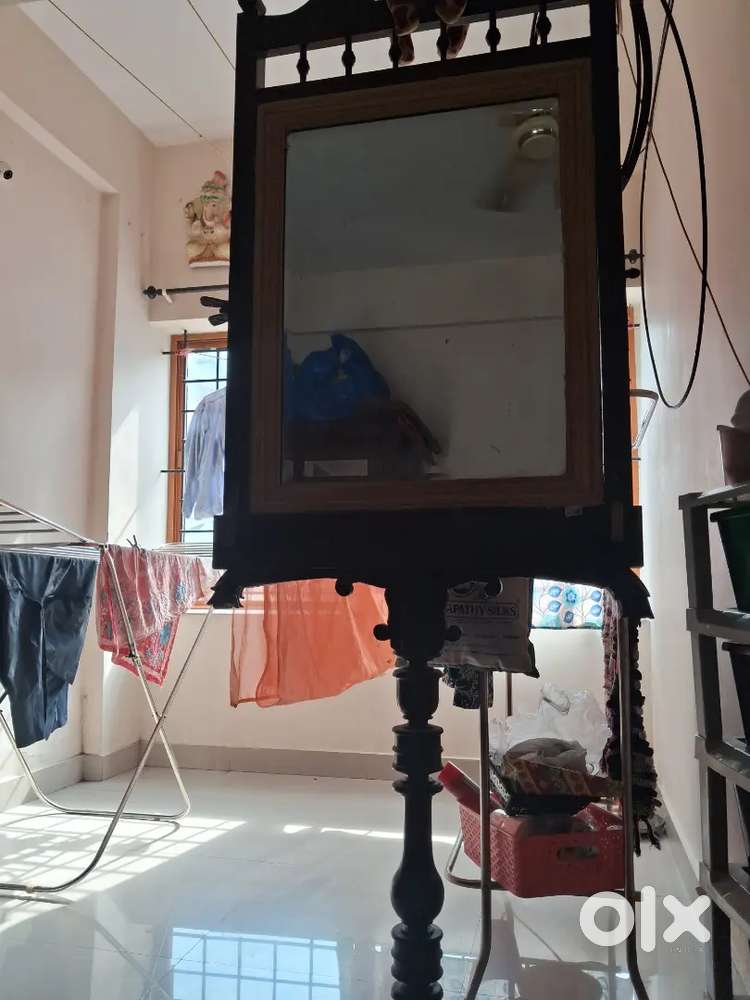 Old wooden mirror with stand