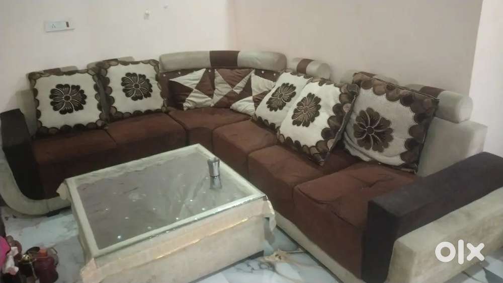 Brand new condition 8 seater sofa with glass table cover and pillows