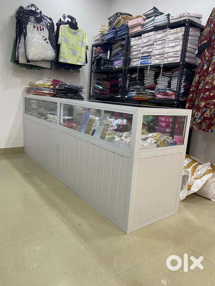 Cash counter and clothes holding cupboard for textiles