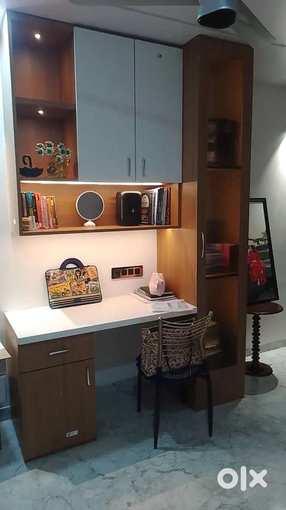 Modular kitchen covered Mandir TV unit