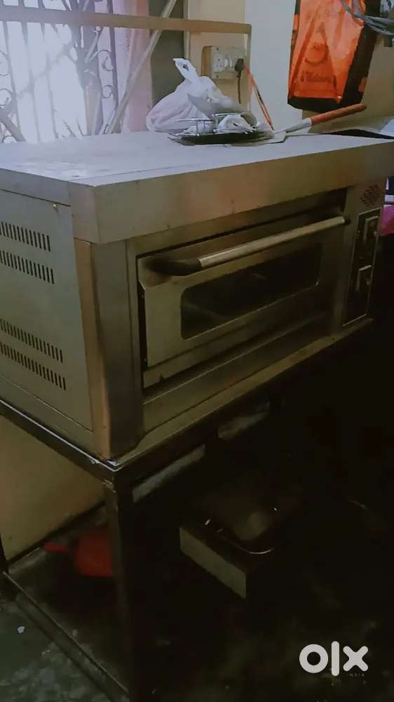 Pizza own .frier griller . Table chair