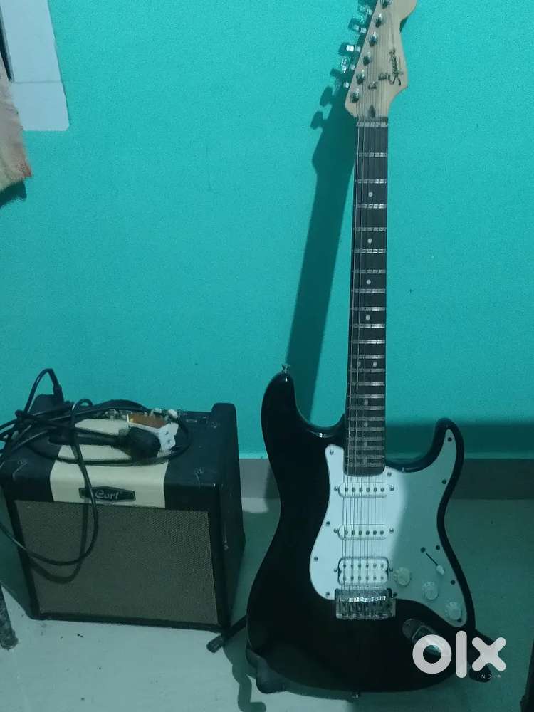 F Squier Electric guitar and cort 15watt amplifier with ibanez cable.