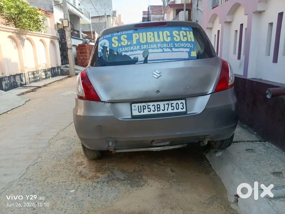 Car Is Of Grey Colour And Some Parts Are Damage