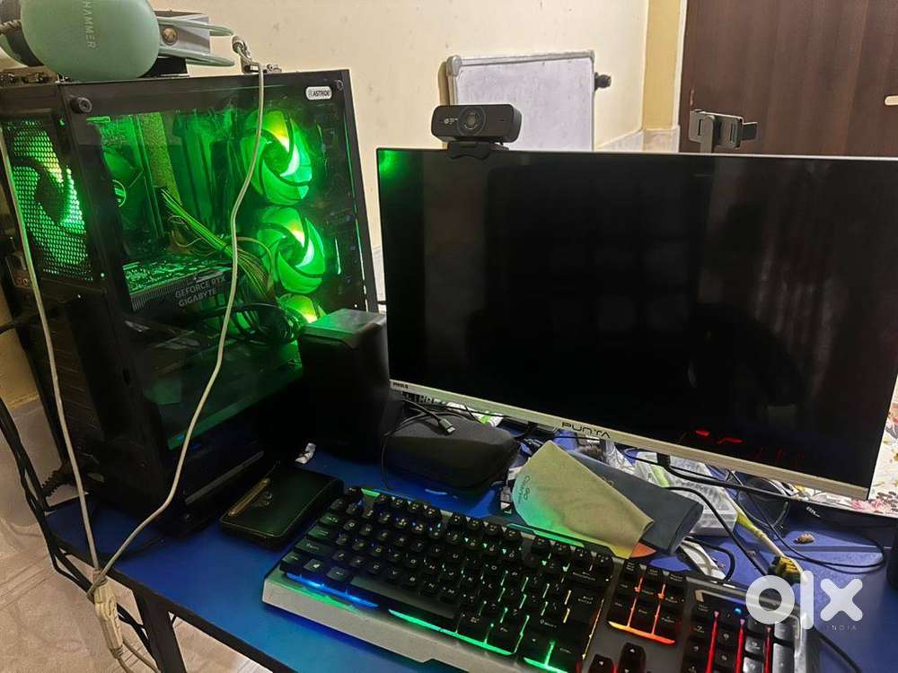 complete pc setup with display, table, chair.