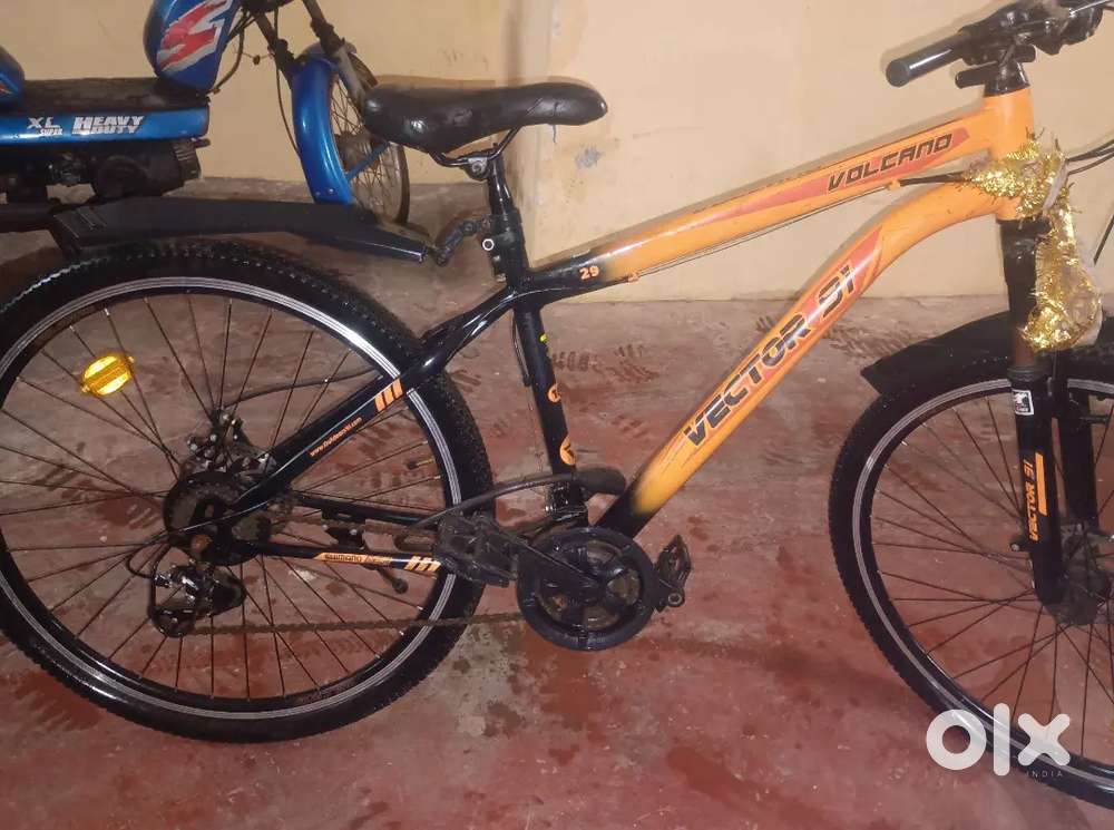 21 gear cycle, dual disc ,orange with front suspension