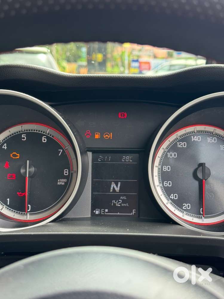Swift 1.2 Vxi 2021 Km Driven