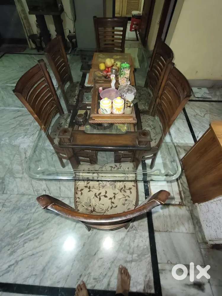 Glass dining table with proper chairs