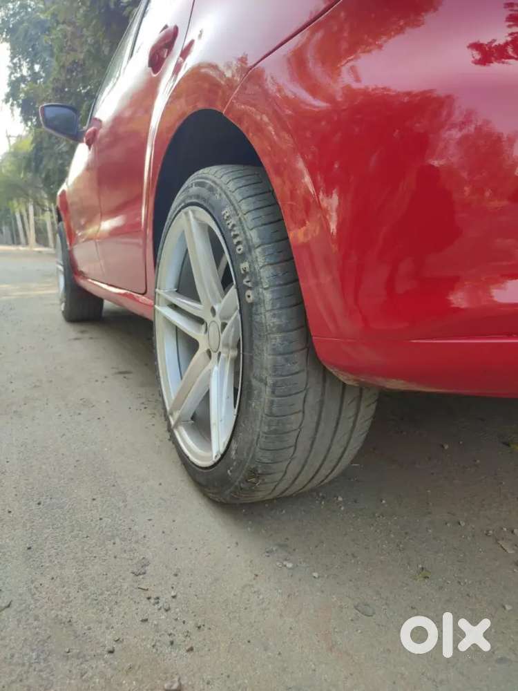 It's A Red Colour Polo With 17 Inchi Alloys