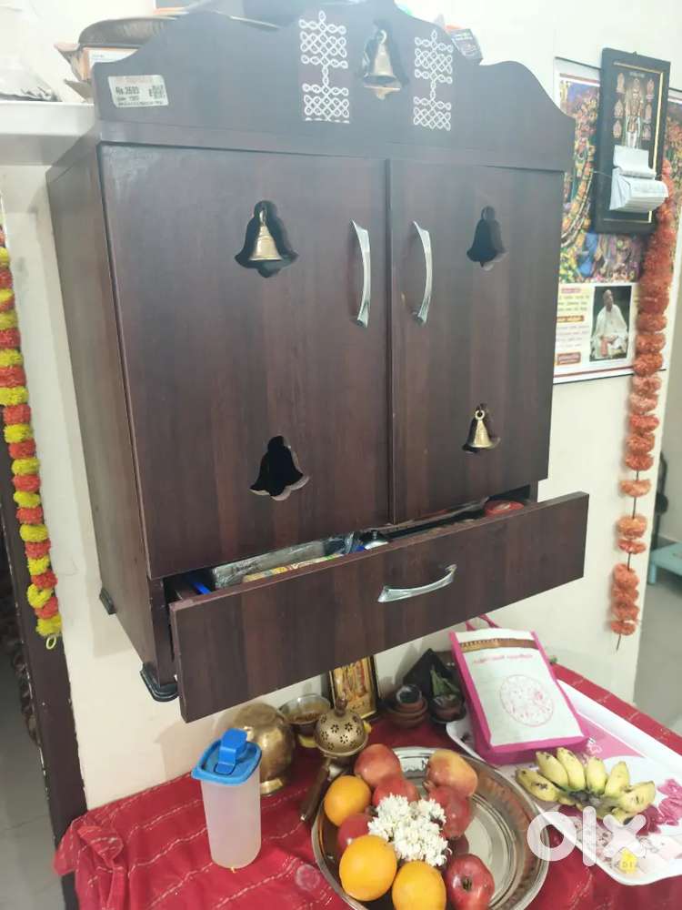 3 people sitting sofa foam type and poojai cupboard