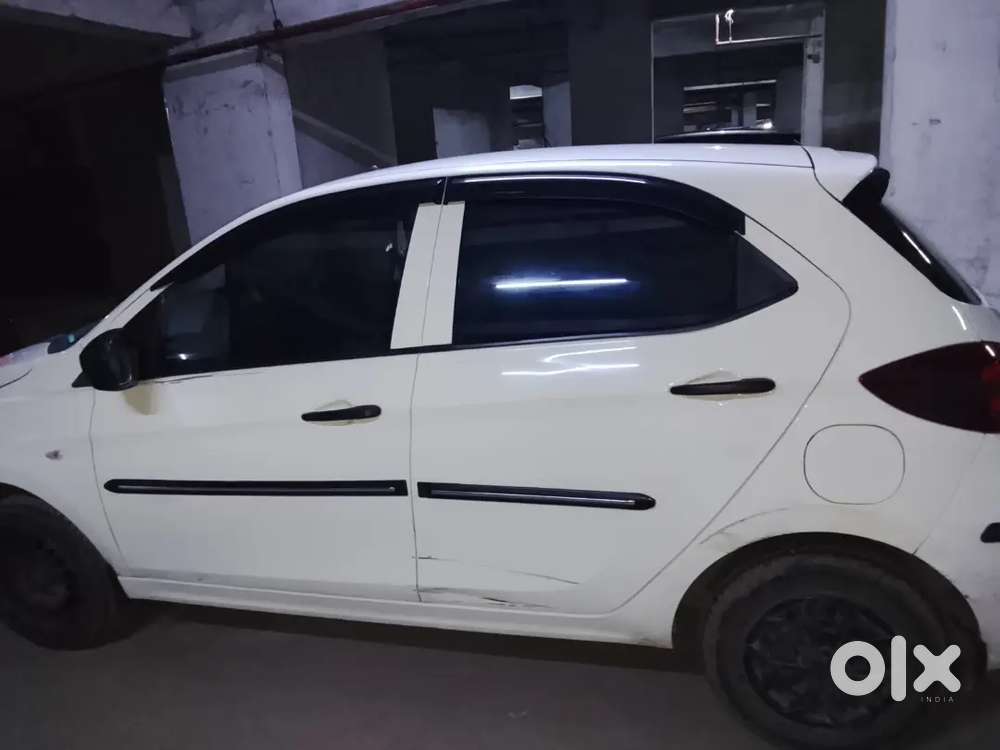 2023 October Tata Tata Tiago Xe (petrol) - White  21,000 Km