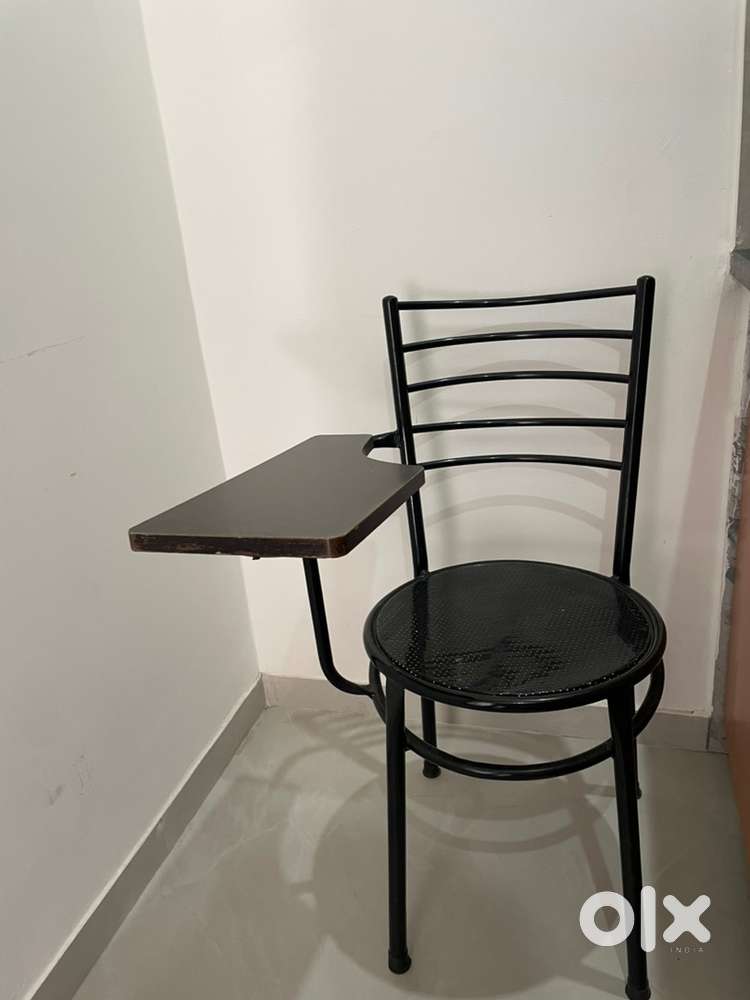 Student chairs with writing pad