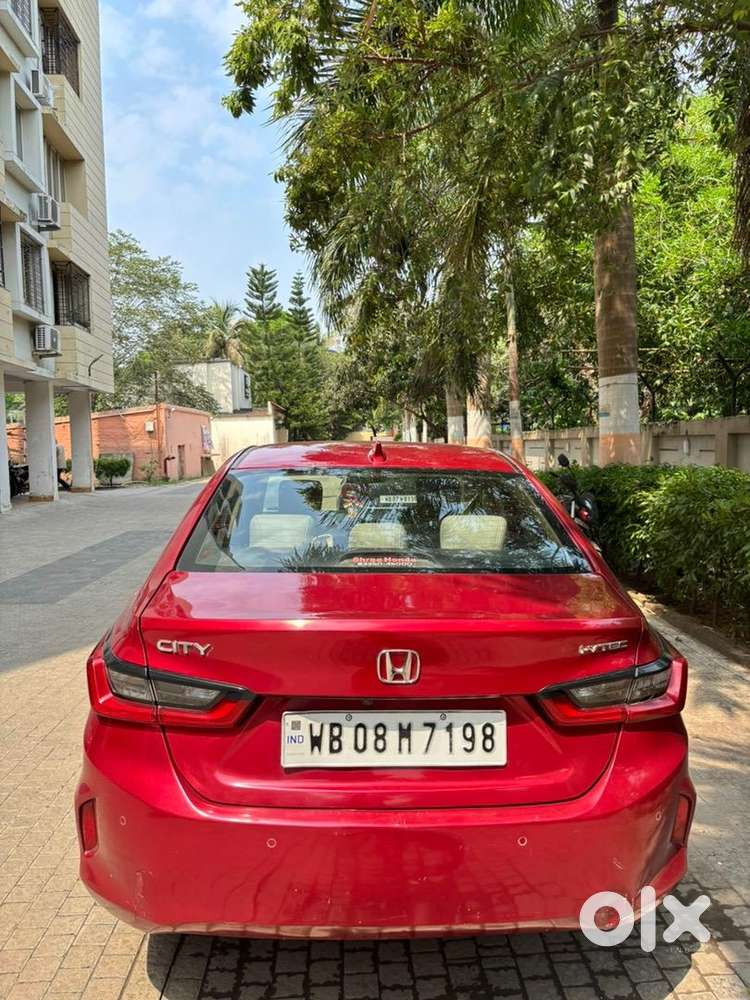 5th Generation Red Colour Honda City V Model Driven By A Ca