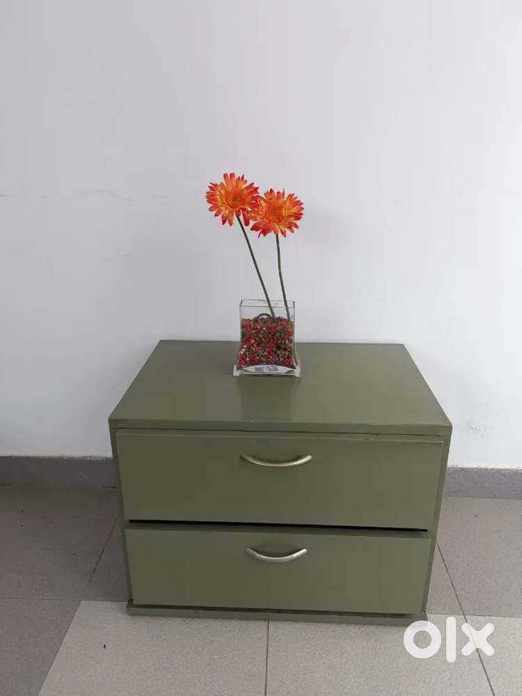 Beside Table made of plywood,  metal trunk.