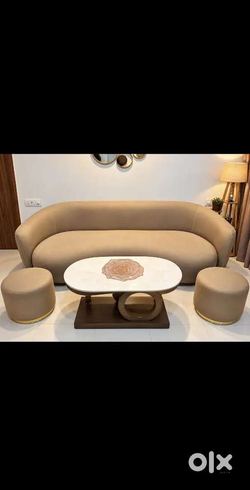 Elegant 3 seater sofa with Ottomans and a center table