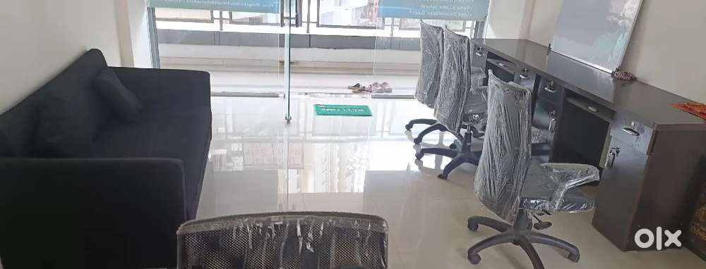 With a sofa , tables and chairs.