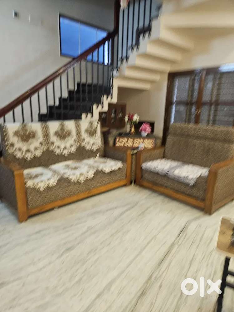 Teak sofa manufactered by ashram showroom