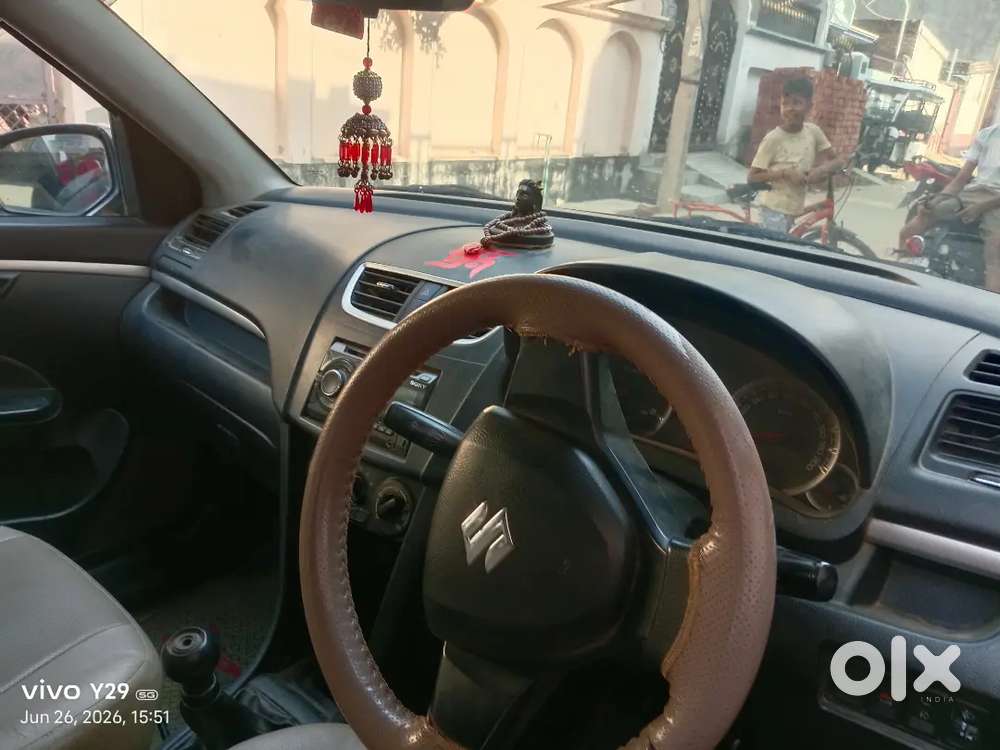 Car Is Of Grey Colour And Some Parts Are Damage
