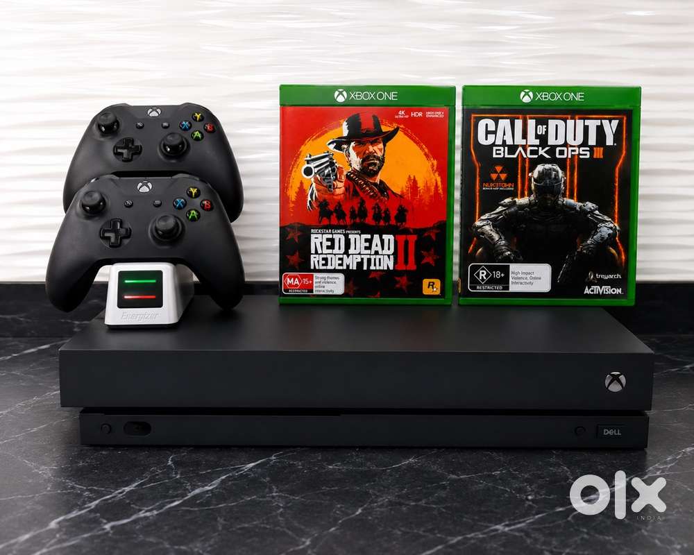X Box One X 1 TB + 2 wireless controller + Charging Dock + 2 Game CD’s