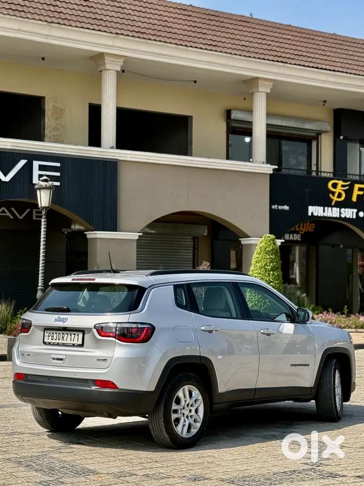 Jeep Compass 4x4 Next To Showroom