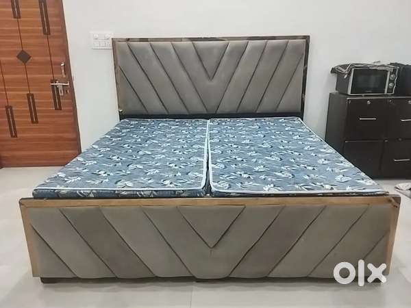 Double bed in grey colour