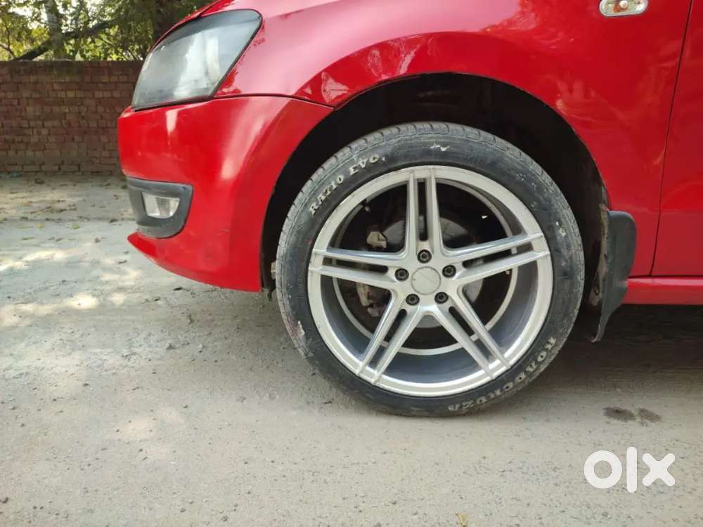 It's A Red Colour Polo With 17 Inchi Alloys