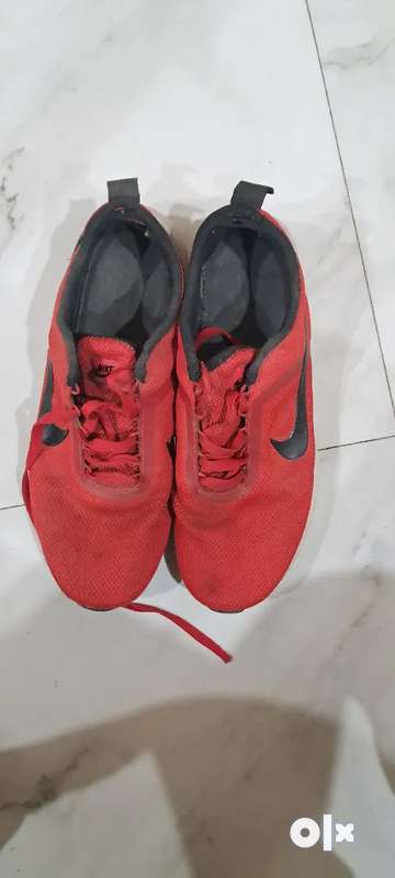 Mens red best sale nike shoes