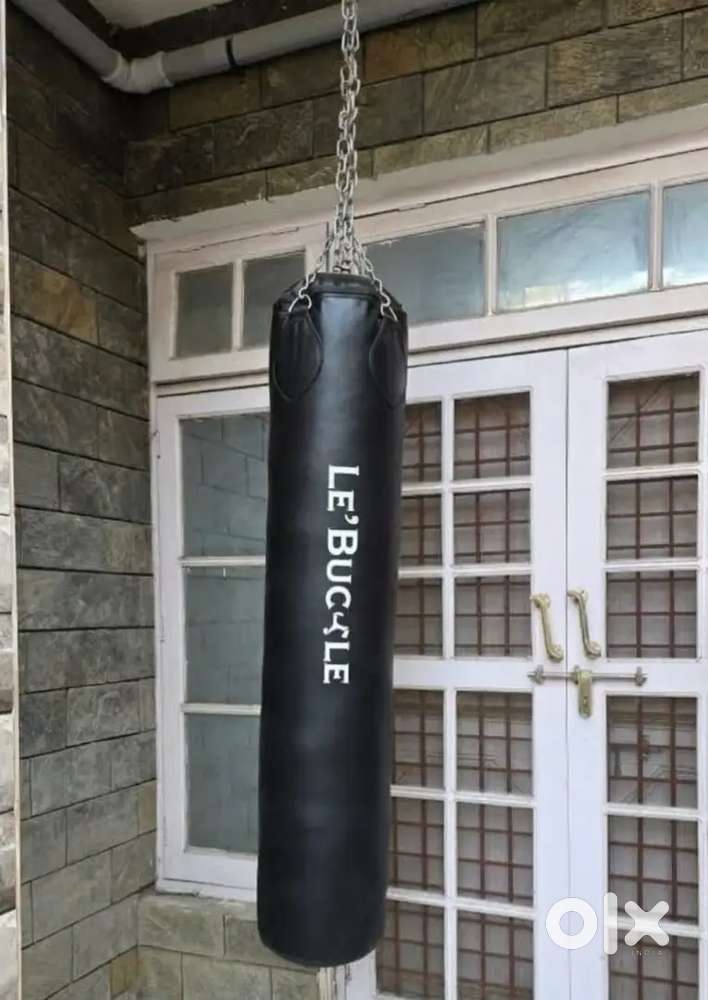 5.5ft filled punching bag along with gloves.