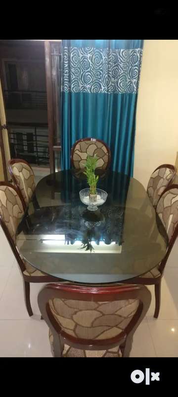 Olx glass dining deals table