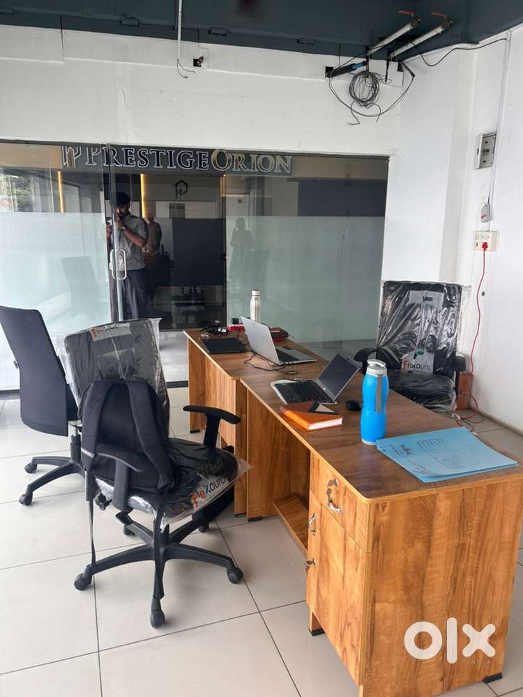 2 officers chairs , 2 office Tabels , 1 Bajaj company Fan