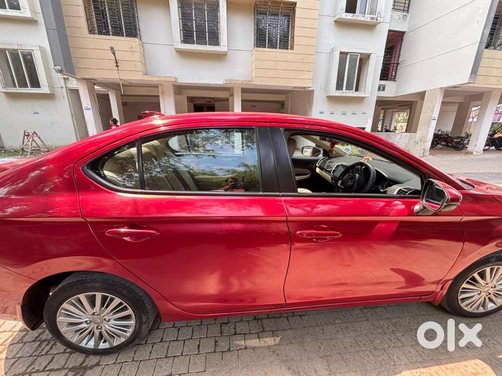 5th Generation Red Colour Honda City V Model Driven By A Ca