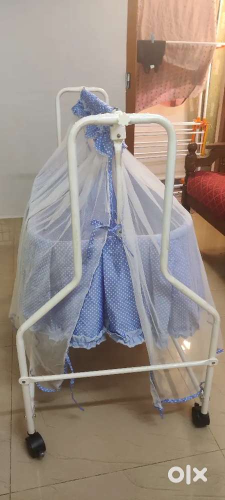 Baby cradle with mosquito net